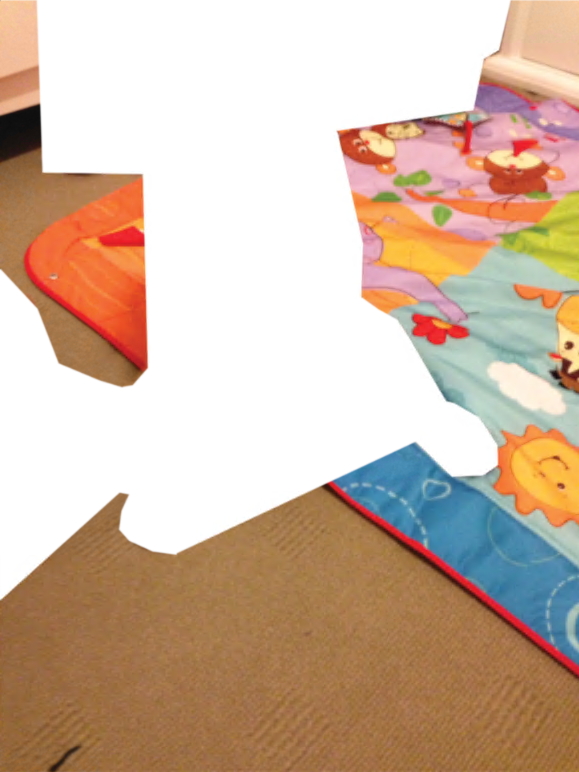 Room with children’s playmat, and mid-tone carpet.