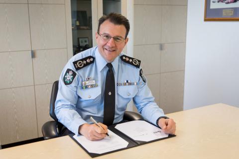 AFP Commissioner Reece P Kershaw signing the MOU